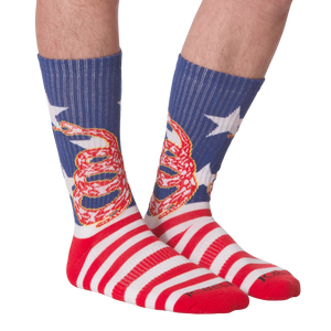 Front view of 'Don't Tread' socks on a person's legs.