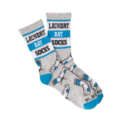 A pair of grey crew socks with teal accents. The socks have 'Laundry Day Socks' written on them and a pattern of small grey socks.
