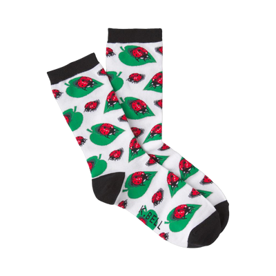 Crew socks in white with a pattern of red ladybugs on green leaves. Black cuffs are visible. 