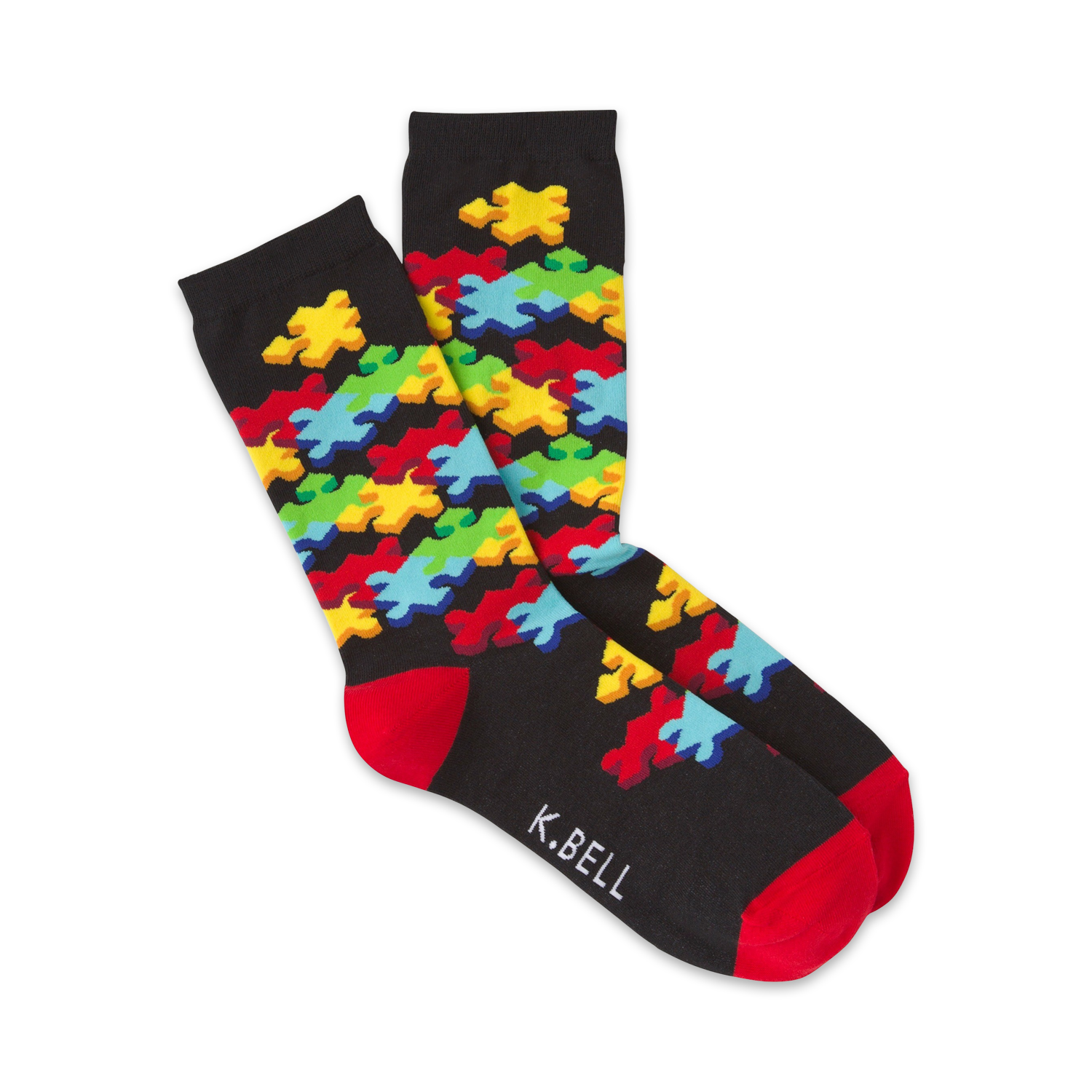 Pair of crew socks on a white background.  The socks are black with a colorful jigsaw puzzle design and red cuffs.