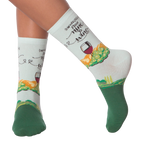 Lifestyle shot showing 'Nine to Wine' socks on a person's legs.