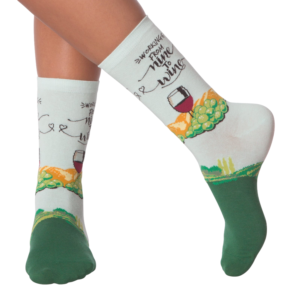 Lifestyle shot showing 'Nine to Wine' socks on a person's legs.