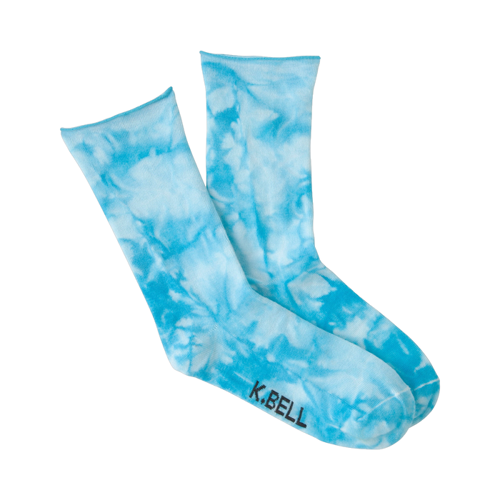 Lifestyle shot showing the light blue tie-dye socks on a model's feet.