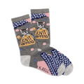 A pair of grey crew socks with a cute cat knitting a ball of yarn. The socks feature pink and blue knit accents and the phrase 'Knit Happens'.