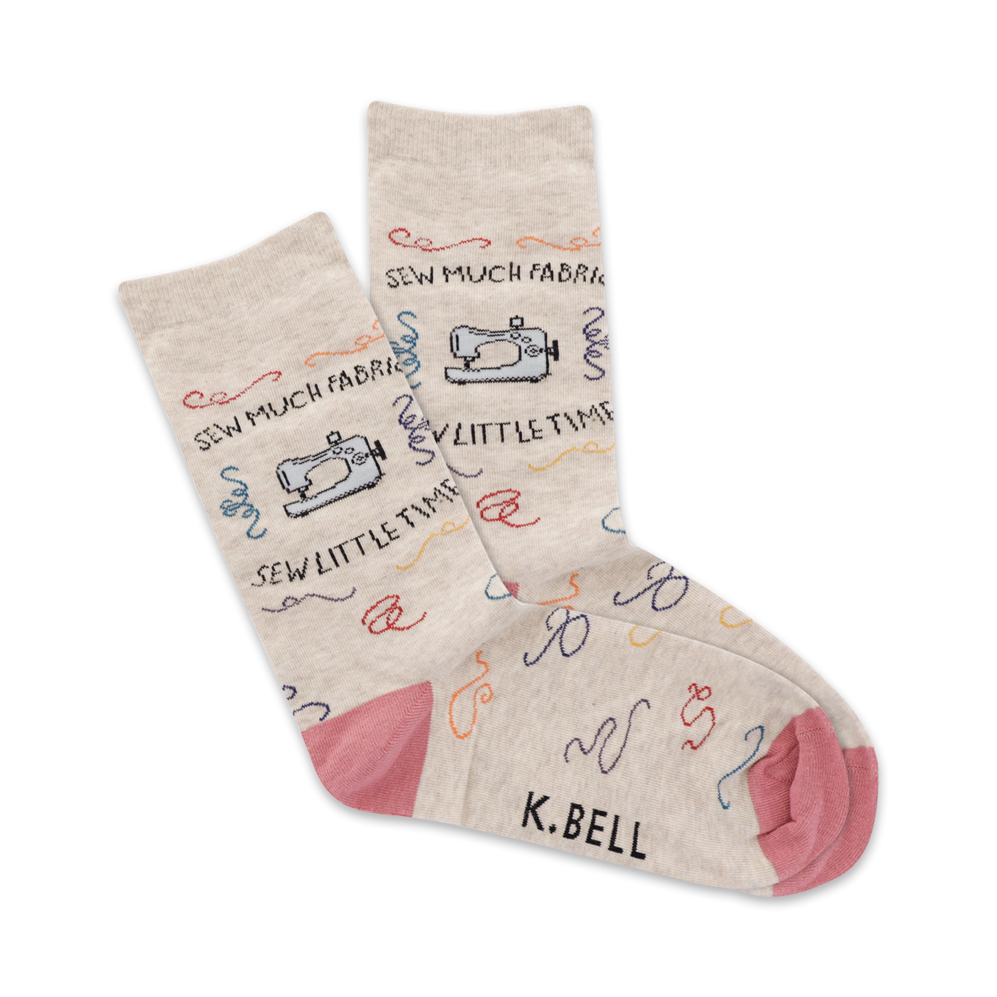 Beige crew socks with colorful sewing machine and thread designs. Pink heel and toe. 'Sew Much Fabric!' written on the socks.