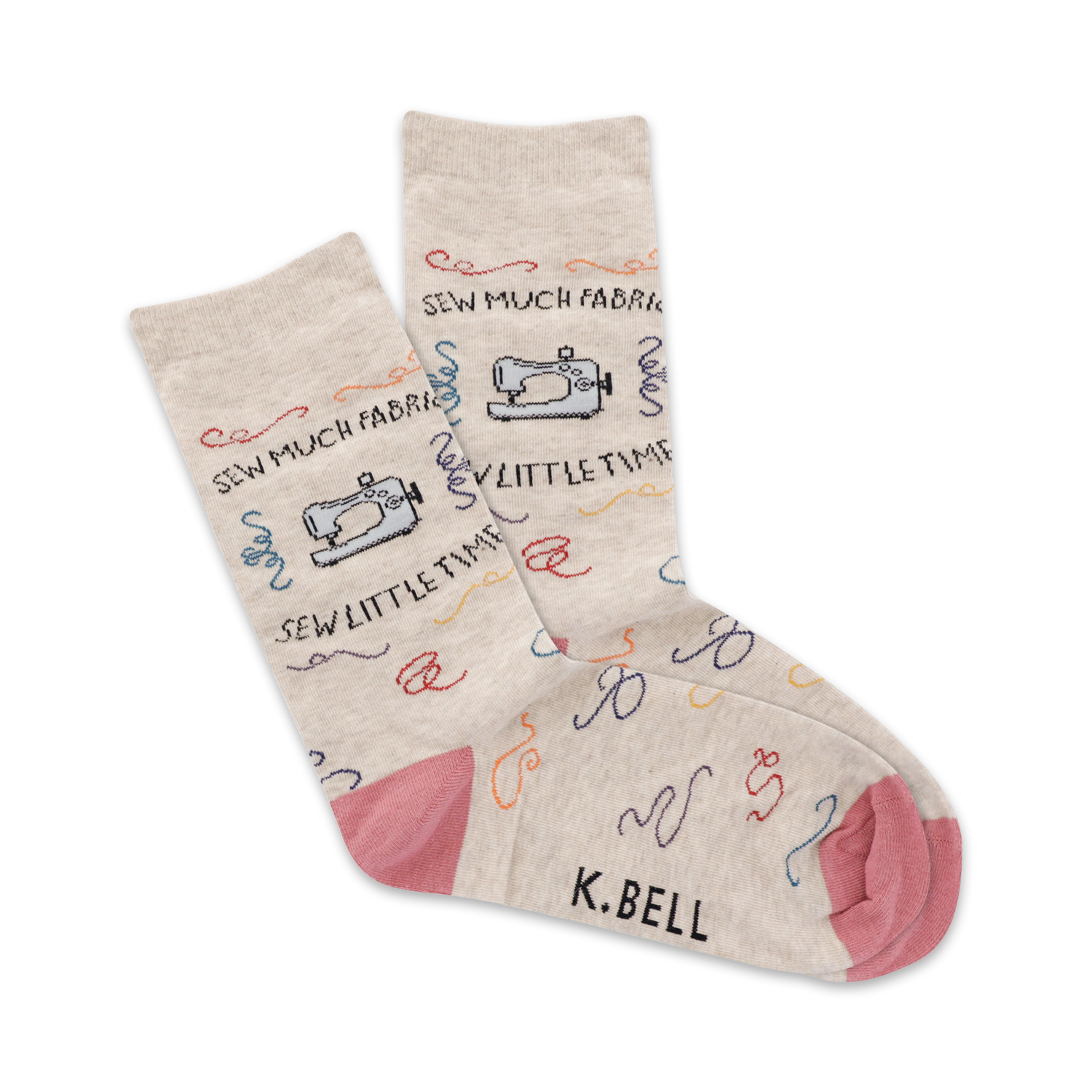Beige crew socks with colorful sewing machine and thread designs. Pink heel and toe. 'Sew Much Fabric!' written on the socks.