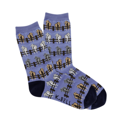 Crew socks in periwinkle blue with a repeating pattern of horses' rear ends peeking over brown fences.  Horses are beige, light gray, and tan.