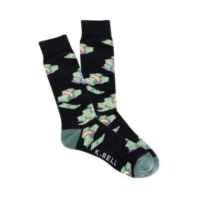 A pair of black crew socks with a pattern of cartoonish green money stacks.  The cuffs are teal green.