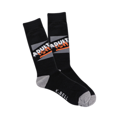 A pair of black crew socks with a gray and orange 'ADULTADULTISH' graphic. The heel and toe are heather gray.