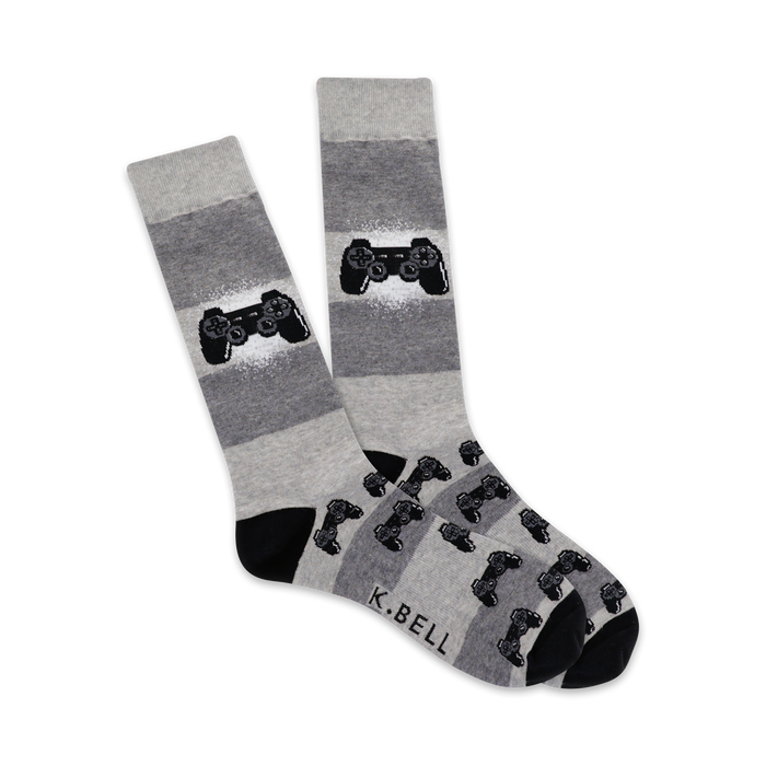 gray crew socks with a pattern of black video game controllers in white and light gray. perfect for men who love video games.   }}