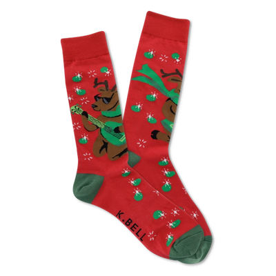 Pair of red crew socks with green cuffs, heels, and toes, featuring brown reindeer in sunglasses playing green guitars with starbursts and green ovals.