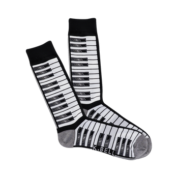 Pair of crew socks with a piano keyboard pattern. The keys are black and grey on a white background. The cuffs are grey.
