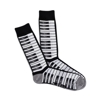 Pair of crew socks with a piano keyboard pattern. The keys are black and grey on a white background. The cuffs are grey.