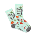 A pair of crew socks on a white background. Light teal socks with a pattern of vegetables and the phrase 'Chop it like it's hot'. Gray heels and toes.