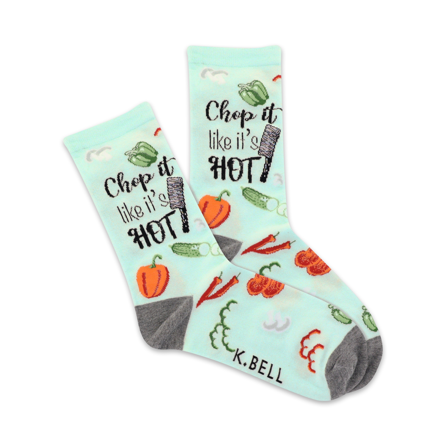 A pair of crew socks on a white background. Light teal socks with a pattern of vegetables and the phrase 'Chop it like it's hot'. Gray heels and toes.
