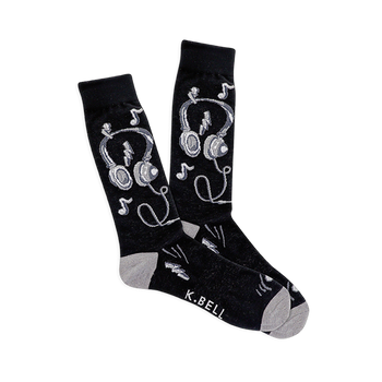 Pair of black crew socks with white and gray headphones, musical notes, and lightning bolt designs. Light gray heel and toe.
