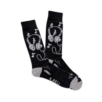 Pair of black crew socks with white and gray headphones, musical notes, and lightning bolt designs. Light gray heel and toe.