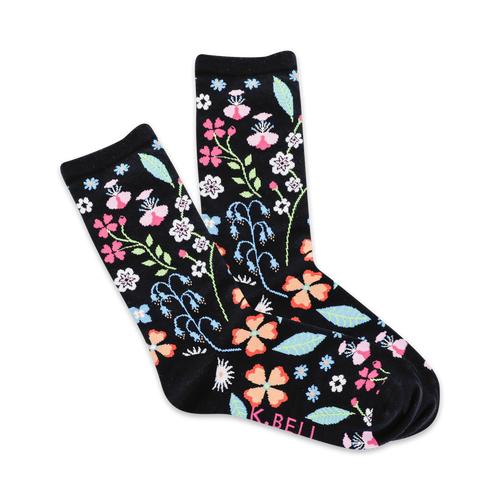 A pair of black crew socks with a colorful floral pattern.  Features pink, orange, and blue flowers and leaves on a dark background.