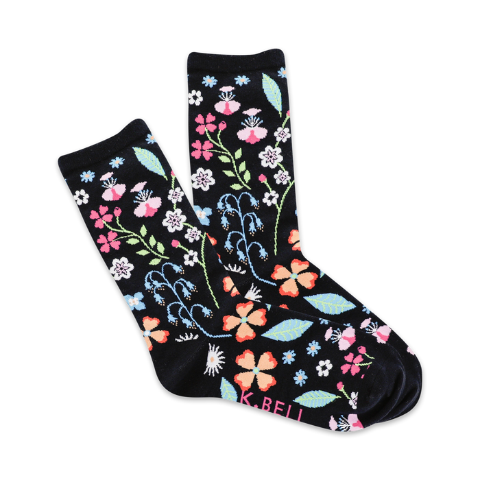 women's floral crew socks: black socks with pink, blue, orange, and white flowers and green leaves.    }}