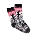 A pair of women's crew socks showcasing a ballerina silhouette against a pink and grey brick pathway. Stars and other small design elements are included.