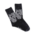 Pair of black crew socks featuring a white, repeated text design: 'I'll stop wearing black when they make a darker color.'