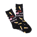 A pair of black crew socks with a playful print of lipstick tubes, pink lips, and the words 'Kiss and Makeup'.
