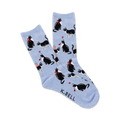 Crew socks in light blue featuring a repeating pattern of black and white tuxedo cats wearing party hats and holding gifts.
