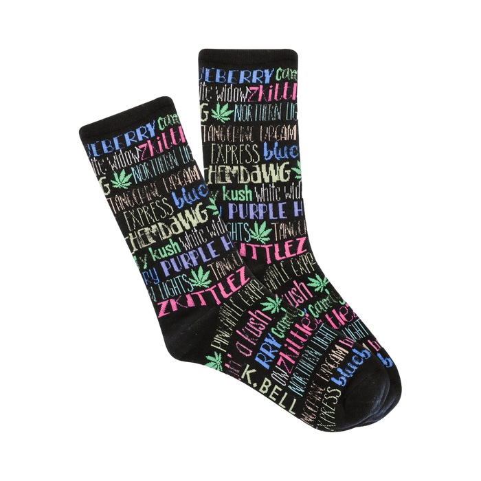Pair of black crew socks. The socks feature a colorful pattern of cannabis strain names (e.g., 'Zkittles', 'Northern Lights') in pink, blue, and purple, with small marijuana leaf graphics. }}