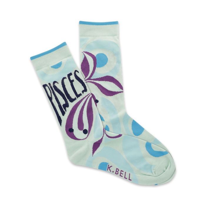 light blue crew socks with purple fish and blue and white bubbles. pisces written in black at top of left sock.   }}