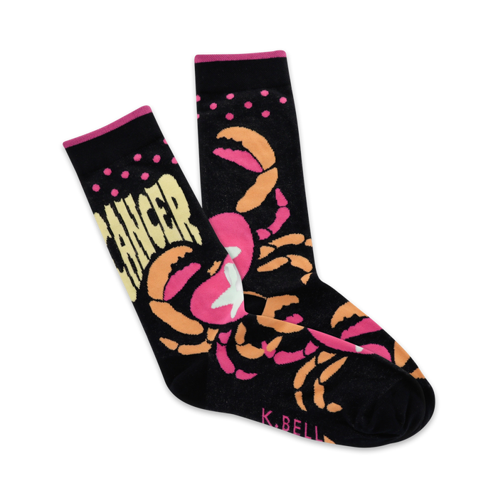 black crew socks with pink and orange crabs and polka dots display 