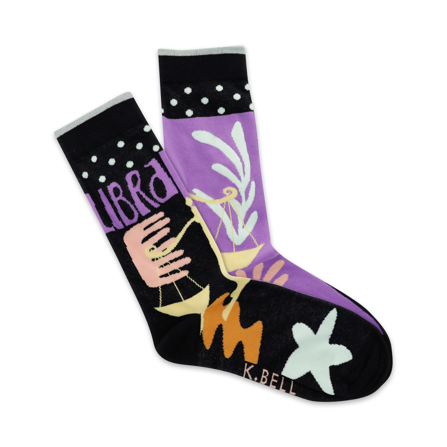 A pair of crew socks in purple and black, featuring the Libra zodiac symbol, pastel design elements, and white polka dots on the cuff.