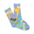 A pair of pastel blue crew socks featuring an illustrated scorpion, sun, and stylized plants.  The word 'Scorpio' is prominently displayed.