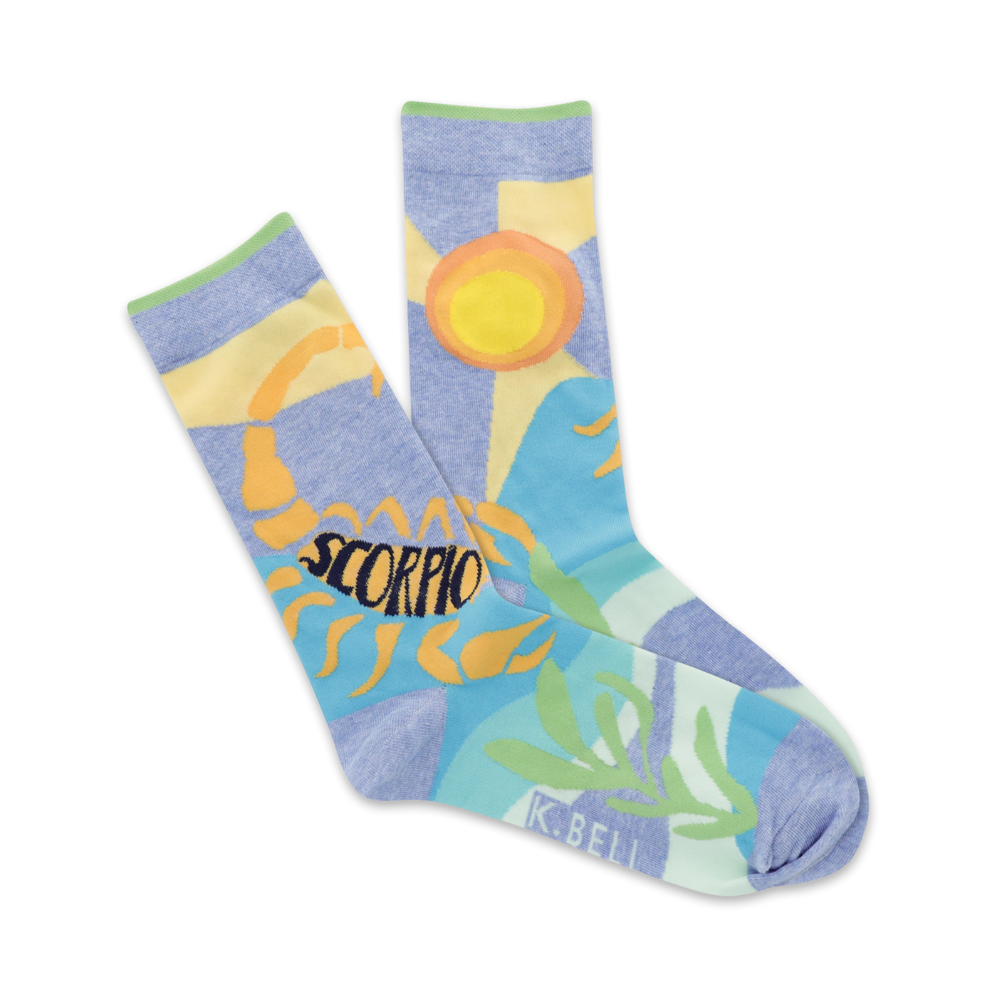 A pair of pastel blue crew socks featuring an illustrated scorpion, sun, and stylized plants.  The word 'Scorpio' is prominently displayed.