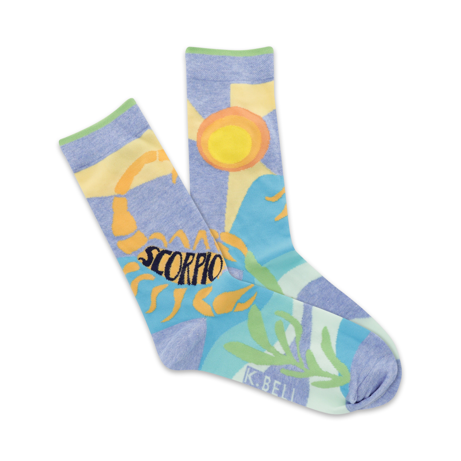A pair of pastel blue crew socks featuring an illustrated scorpion, sun, and stylized plants.  The word 'Scorpio' is prominently displayed.