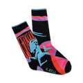 A pair of crew socks showcasing a stylized Capricorn in teal, against a black background with orange and pink accents.