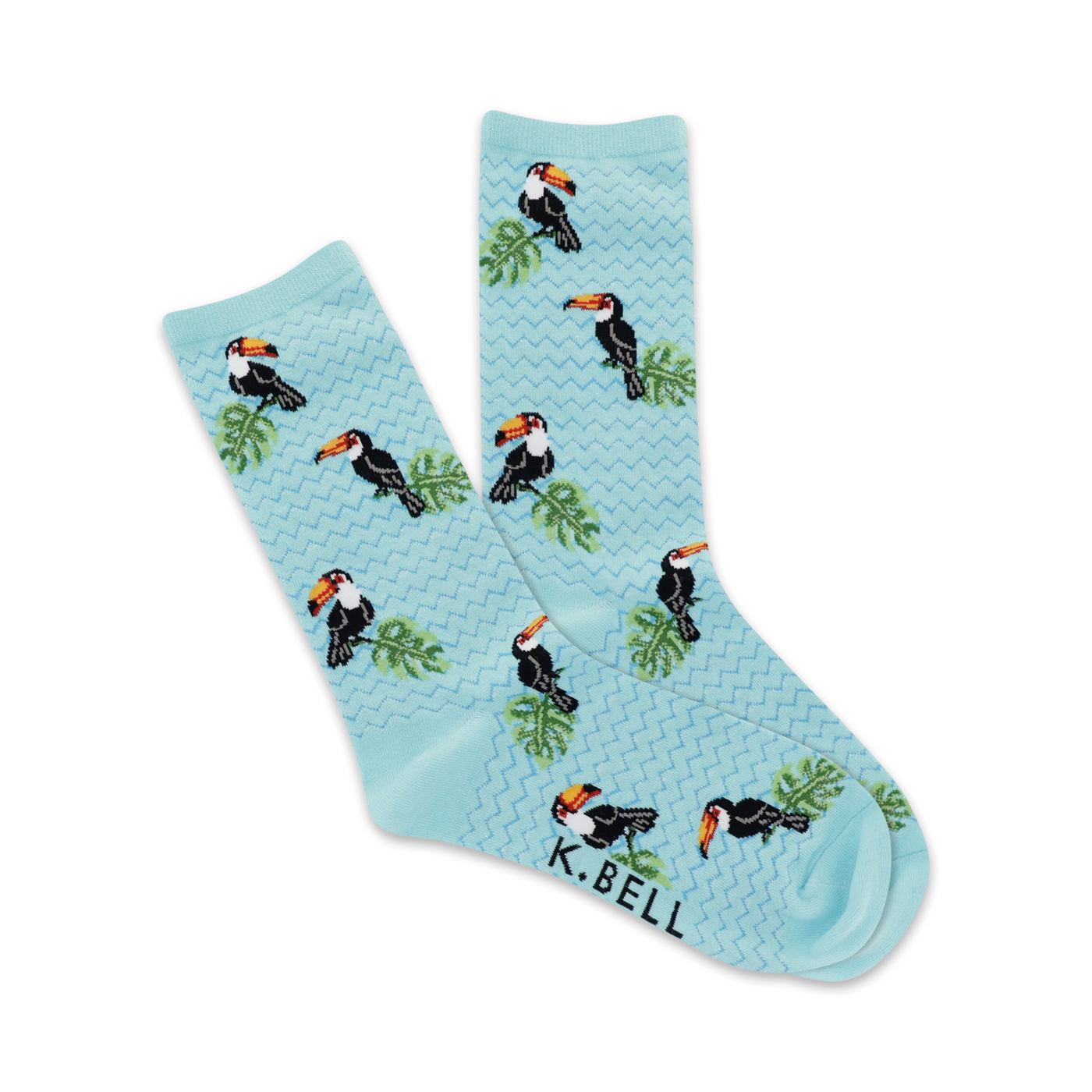 Pair of light blue crew socks with a repeating pattern of colorful toucans and tropical leaves.