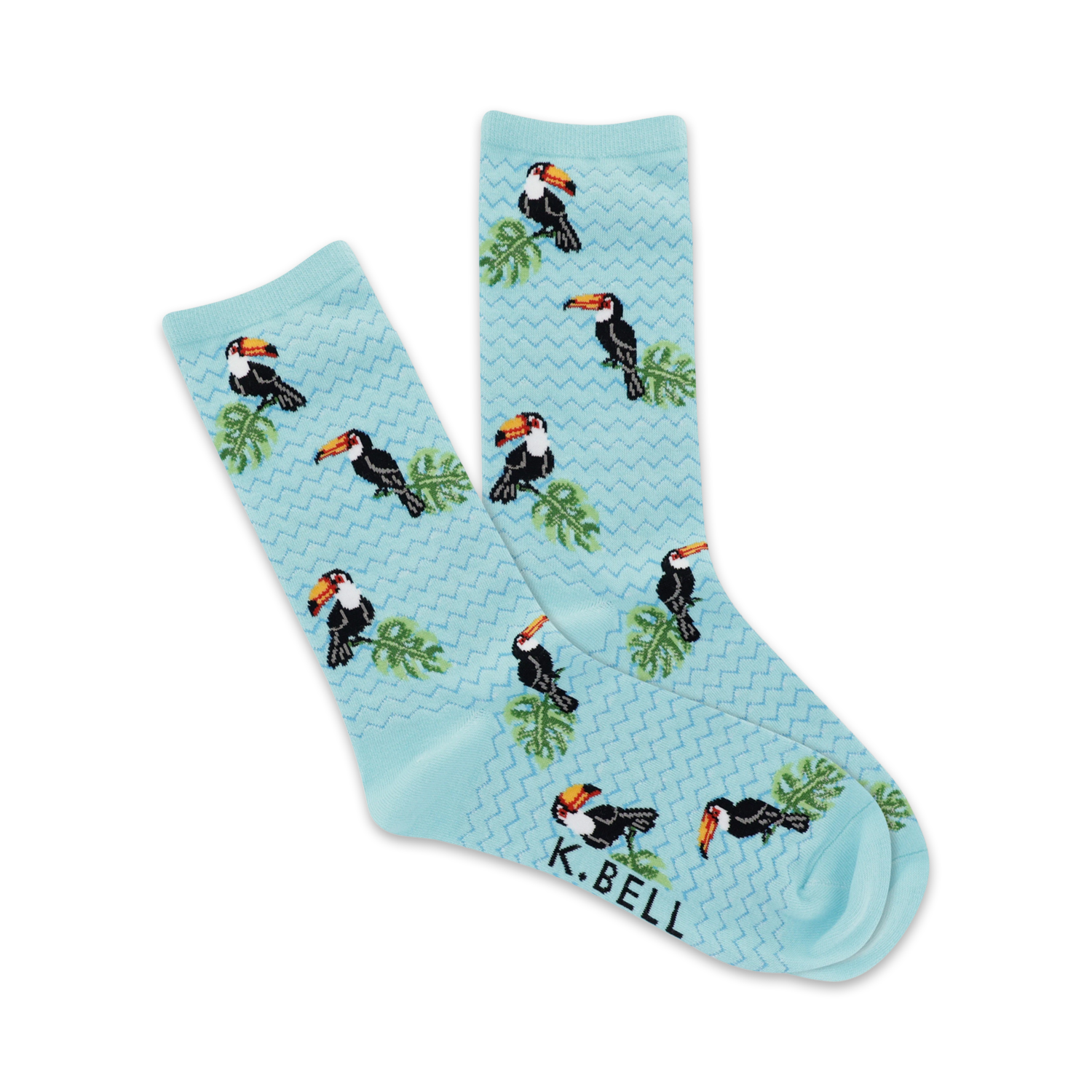 Pair of light blue crew socks with a repeating pattern of colorful toucans and tropical leaves.