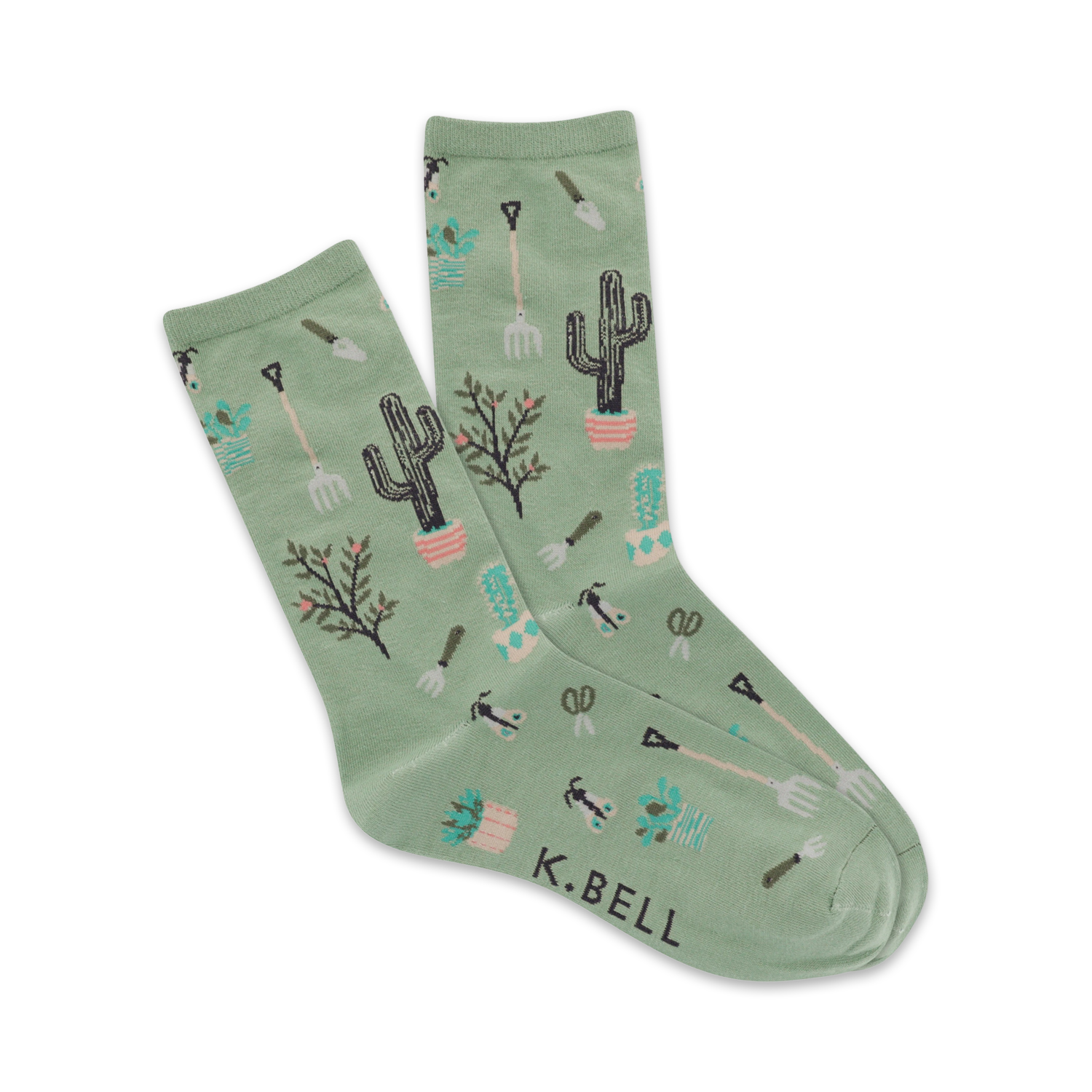 Pair of sage green crew socks featuring cacti, gardening tools, and small plants in a repeating pattern.