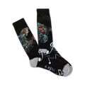 Pair of black crew socks with a colorful illustration of a musician playing guitar and musical notes. 