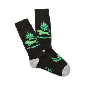 black crew socks featuring a green pattern of marijuana leaves and a green iguana in a sombrero. cannabis theme.  