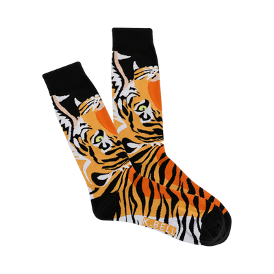 A pair of crew socks with a tiger face design. The tigers are predominantly orange and black with green eyes, set against a black background.