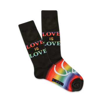 black cotton crew socks with bright rainbow-colored words love is love and rainbow peace sign on white toes.  