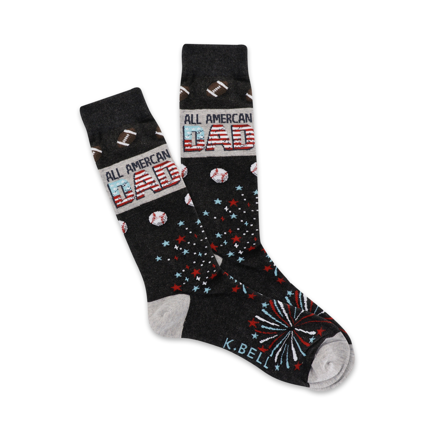 Pair of dark gray crew socks with an 'All American Dad' design. Features red, white, and blue stars, baseballs, footballs, and fireworks.