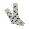 A pair of light gray crew socks with a repeating pattern of pixelated toucans and green leaves.  The socks are folded slightly.