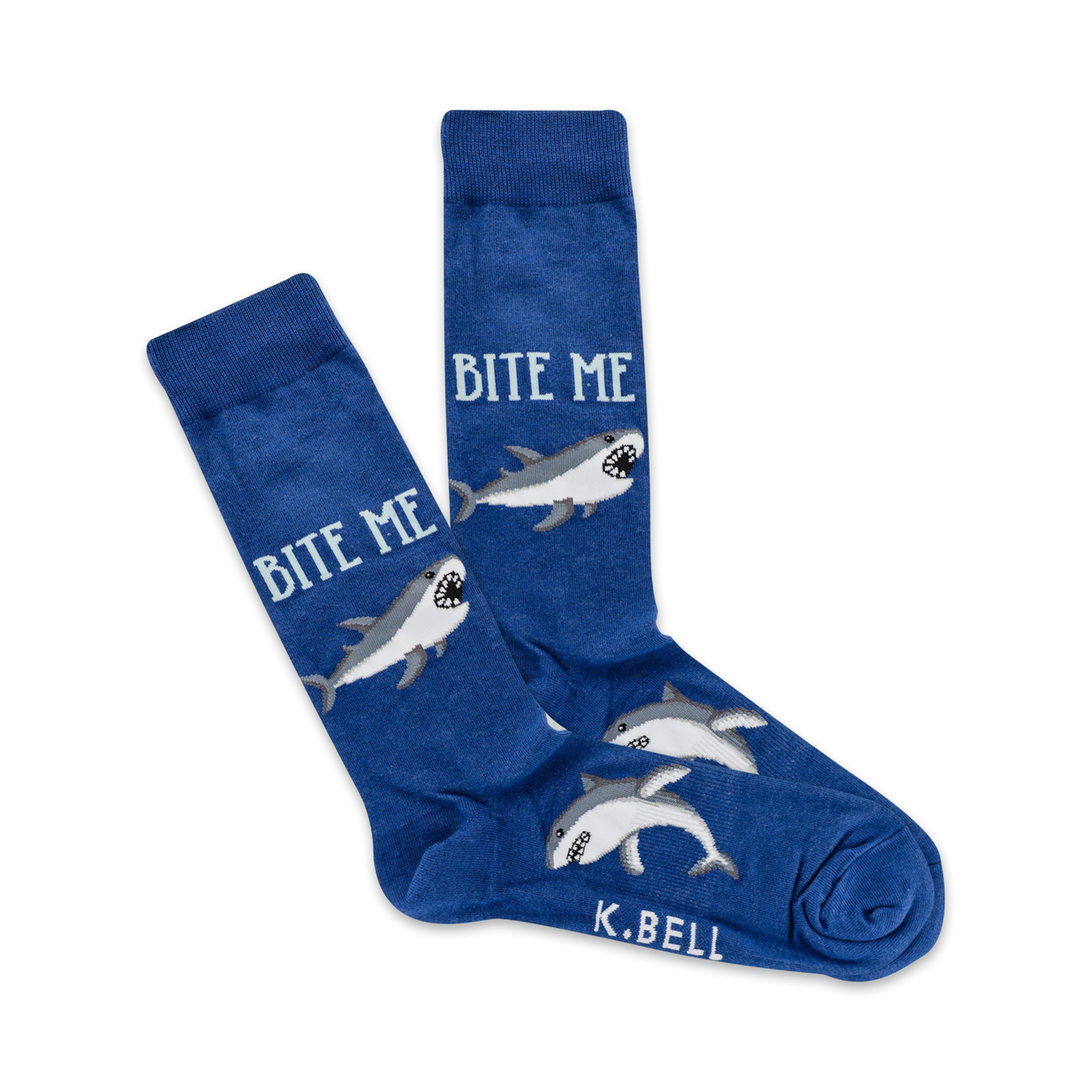 A pair of blue crew socks with grey sharks and the text 'Bite Me' printed on them. 