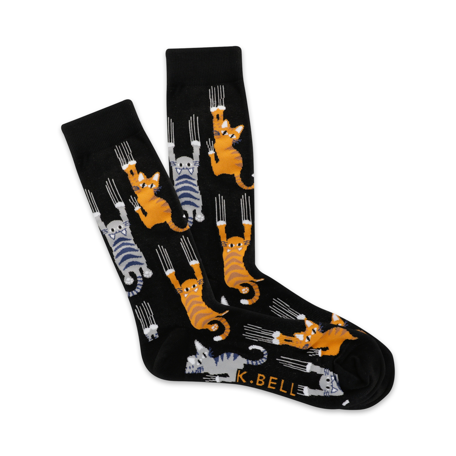 Pair of black crew socks with orange and gray cats clinging playfully. The cats have sharp claws and are set against a dark background.