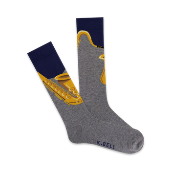 Pair of grey crew socks with a gold saxophone design. The socks have a navy blue cuff.