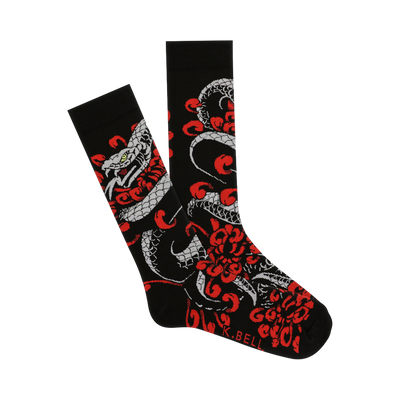 Black crew socks with a detailed Japanese-style tattoo print of a grey snake and red chrysanthemum flowers. 