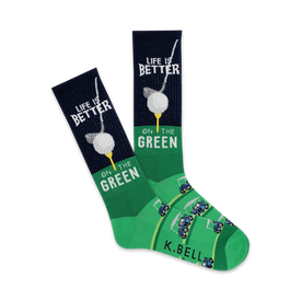 dark green crew socks with a white golf ball on tee and black and white golf cart pattern. 'life is better on the green' is written on top of each sock.  