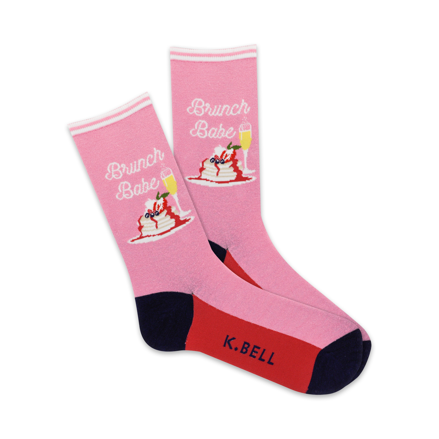 A pair of pink crew socks with a graphic of pancakes, berries, and champagne.  The socks have navy and red accents and say 'Brunch Babe'.